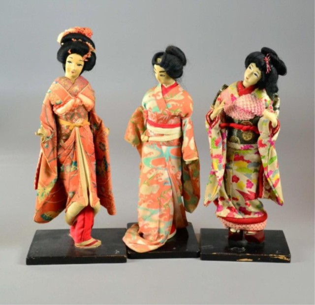  3 JAPANESE GEISHA DOLLS ON STANDSThree 1734a4