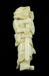 A Meiji period ivory netsuke carved