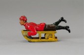 BOY ON SLED TOY Germany Hess lithographed