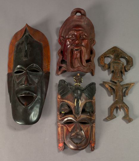 Collection of Four Carved Masks,  consisting