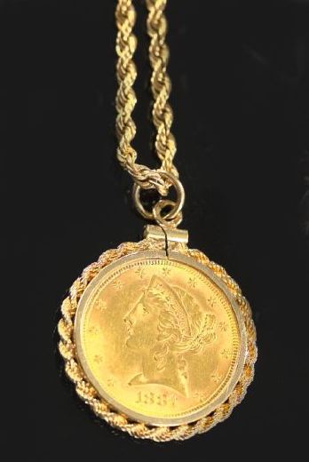 United States $5.00 Gold Piece,  on a fourteen-karat