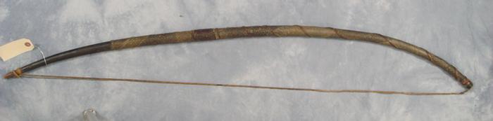 Native American bow wrapped with snakeskin,