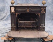 Cast iron and brass parlor stove, early