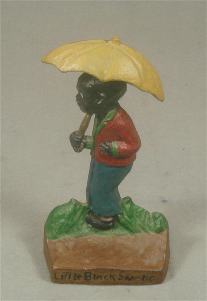 Cast iron doorstop, child under umbrella