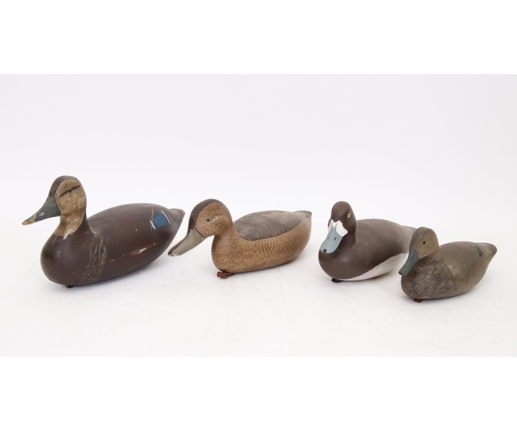 Four duck decoys to include a green 28a959