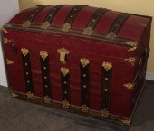 A 19TH CENTURY HUMP BACK TRAVEL TRUNK