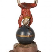A Spinning Clown on Globe Cast Iron
