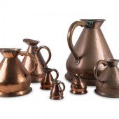 Seven Copper Graduated Pitchers
19th/Early