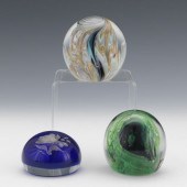 THREE GLASS PAPERWEIGHTS  One green