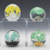 FOUR FLOWER PAPERWEIGHTS  Including