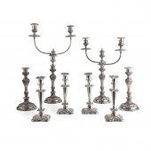 A SUITE OF FOUR TABLE PLATED CANDLESTICKS 2cc765