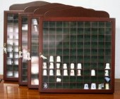 Four thimble display cabinets, each
