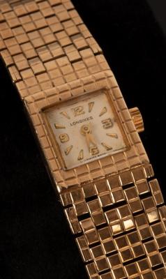A Longines gold watch with gold 2db429