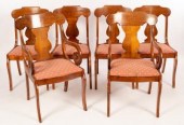 A set of six stained beech dining chairs