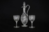 A Victorian etched glass ewer and two