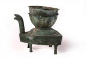 A Han dynasty bronze stove, in five