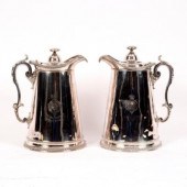 A pair of large silver plated jugs,