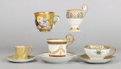Porcelain cup and saucer grouping to