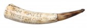 A carved powder horn of uncertain age