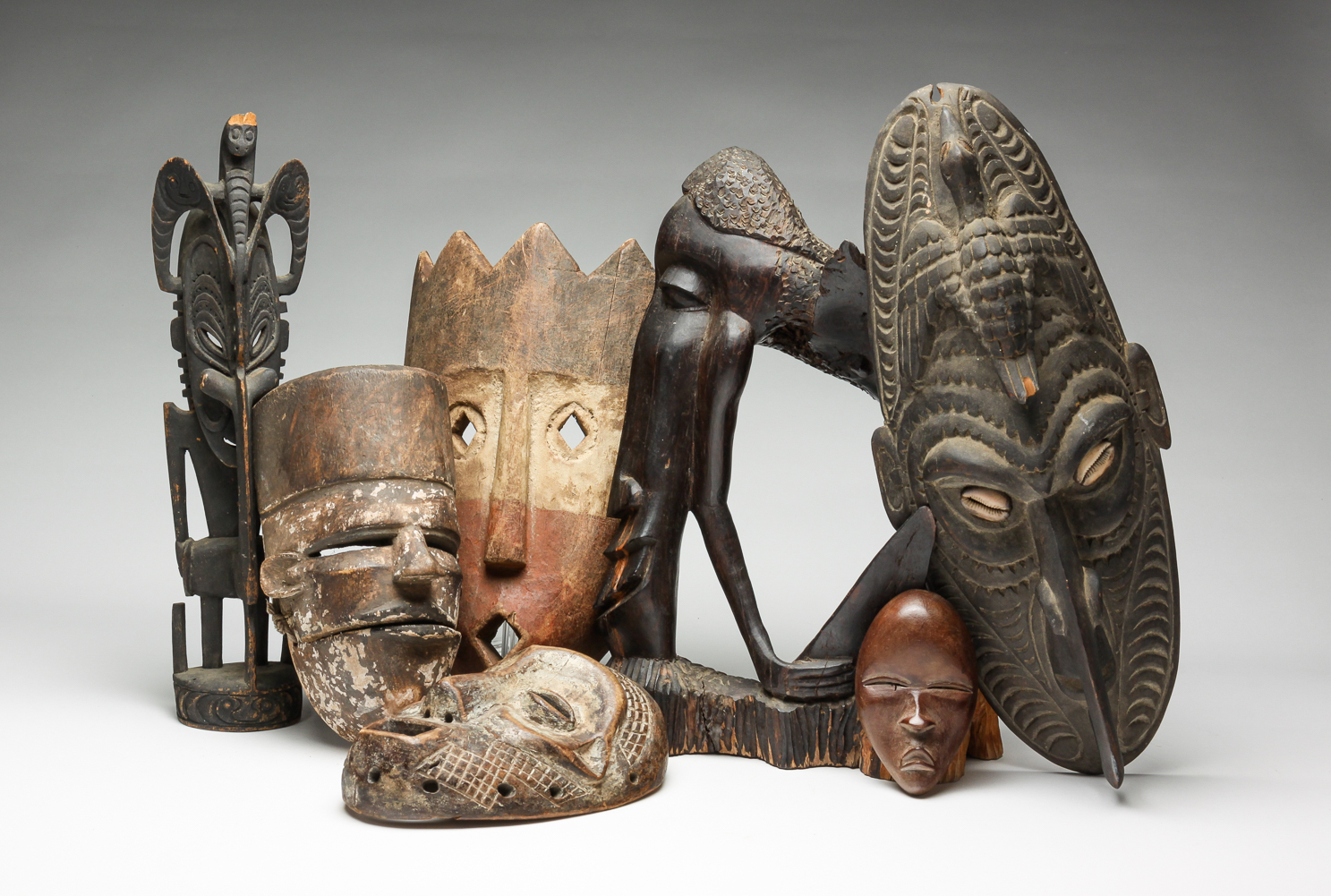 SEVEN AFRICAN WOODEN MASKS AND 2dfa78