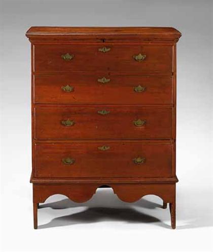 Red-stained cherry blanket chest with drawers