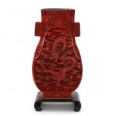 A CHINESE RED CINNABAR LACQUER STYLE