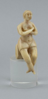 WHALE IVORY CARVING OF A SEATED 2f28c9