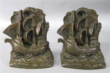 Five pairs of patinated metal bookends 4bf85