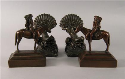 Two pairs of American bronze bookends   