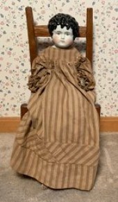 Victorian china head doll in old brown