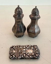 A pair of 3 H salt shakers marked 3068eb