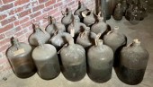 Fifteen vintage glass carboy jugs with