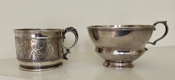 A handled silver mug with embossed 306ad2
