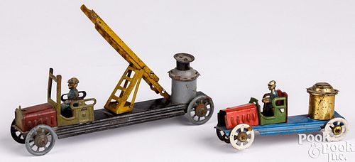 TWO TIN FIRE TRUCK PENNY TOYSTwo