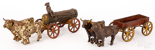 TWO HUBLEY CAST IRON OX DRAWN WAGONSTwo 30d4ee