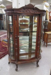 CARVED OAK AND CURVED GLASS CHINA CABINET,