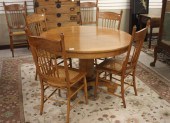 ROUND OAK DINING TABLE AND SIX CHAIRS,