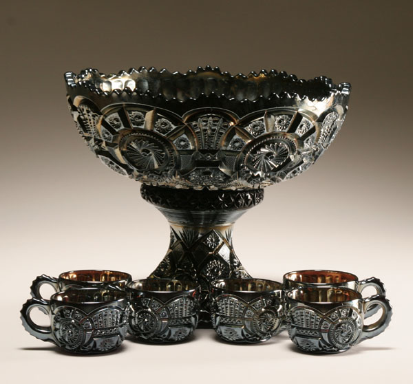 Carnival glass punch bowl with matching cups;