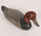 A duck decoy signed and dated R. Madison