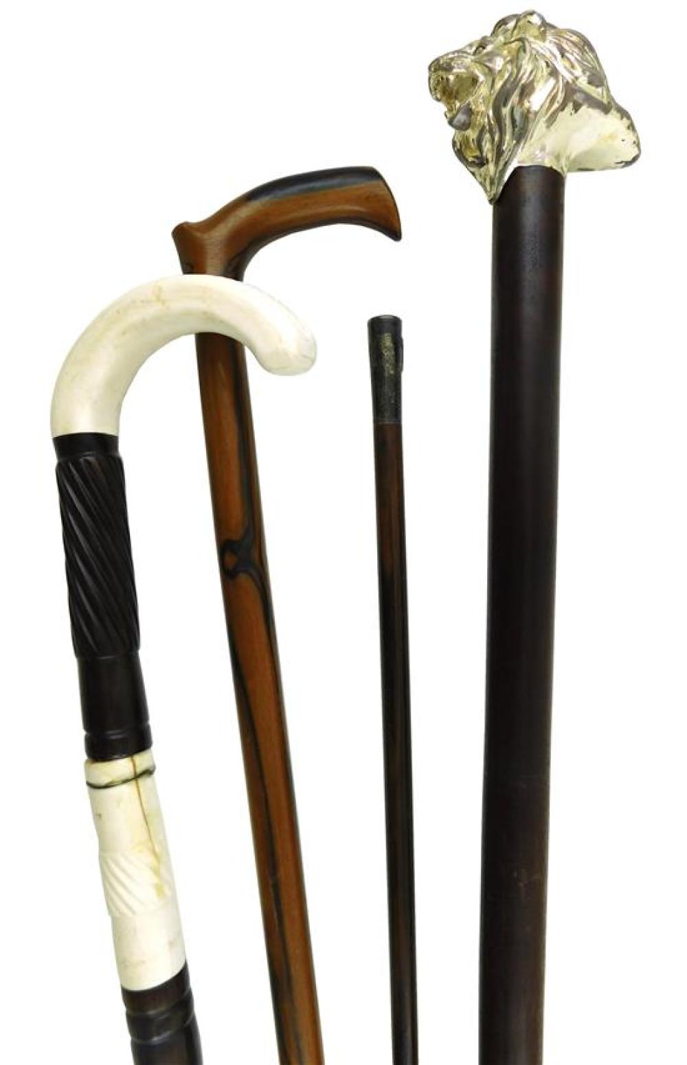 FOUR WALKING STICKS AND CANES  31db58