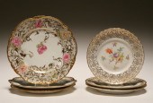 Six hand painted floral and gilt plates,