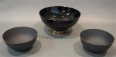 TWO BLACK BASALT BOWLS AND A STERLING