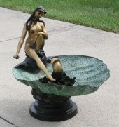 Decorative patinated bronze garden fountain
