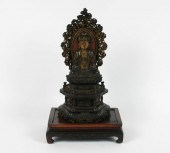 Asian religious figure; intricately