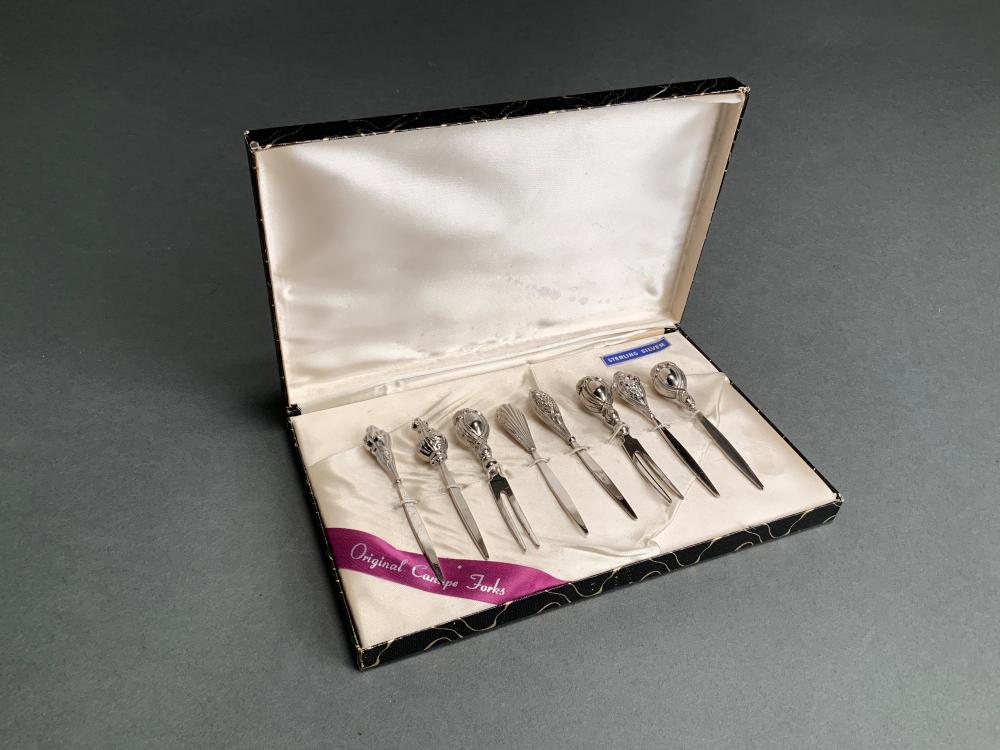 EIGHT STERLING SILVER CANAPE FORKS 32d7b6