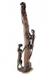 MONKEY UP A TREEwood carved statue depicting