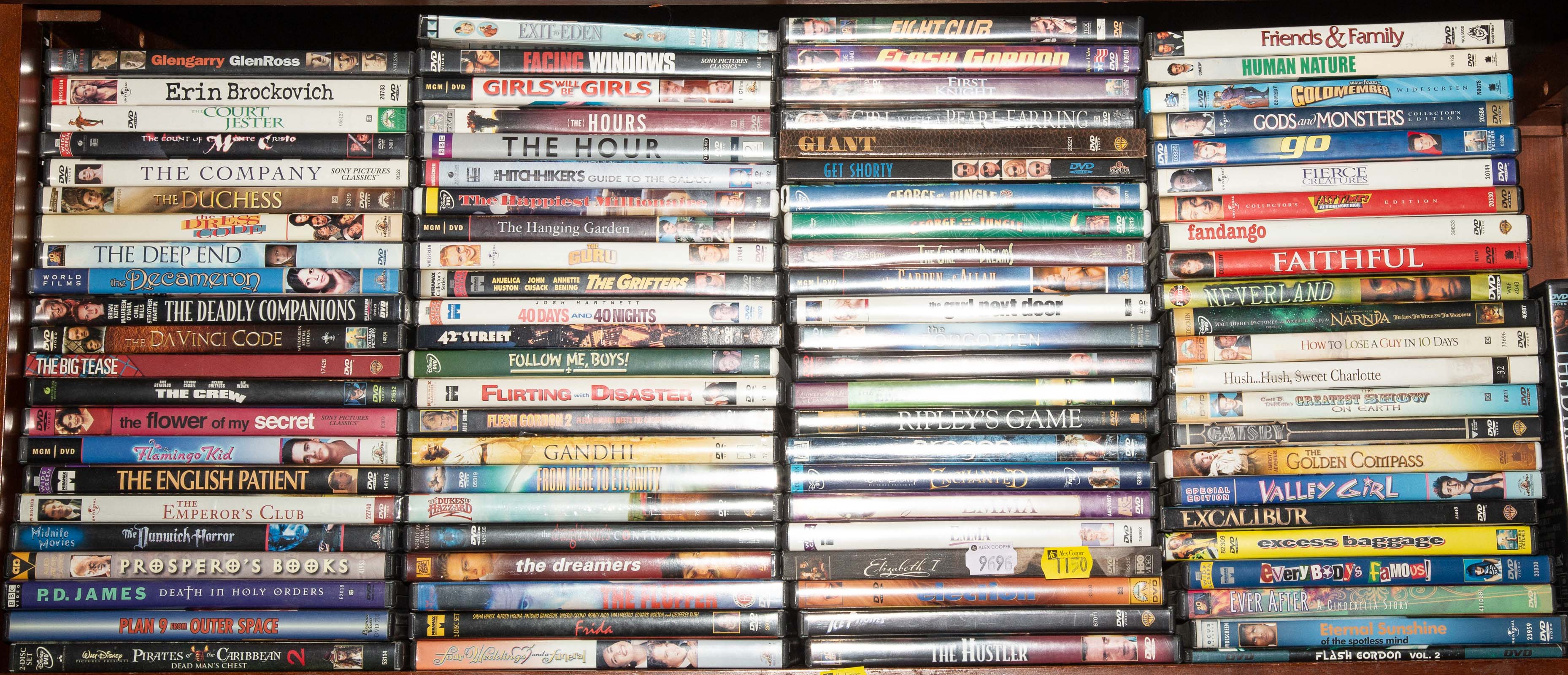 A SHELF OF ASSORTED DVDS Comprising 334c99