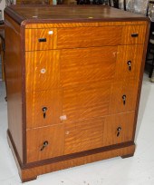 AN ART DECO WATERFALL STYLE CHEST
