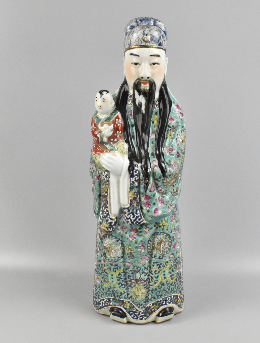 CHINESE FAMILLE ROSE FIGURE HOLDING 33a1c4