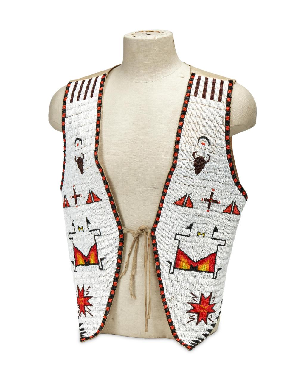 A SIOUX BEADED HIDE VEST, BY ARCHIE